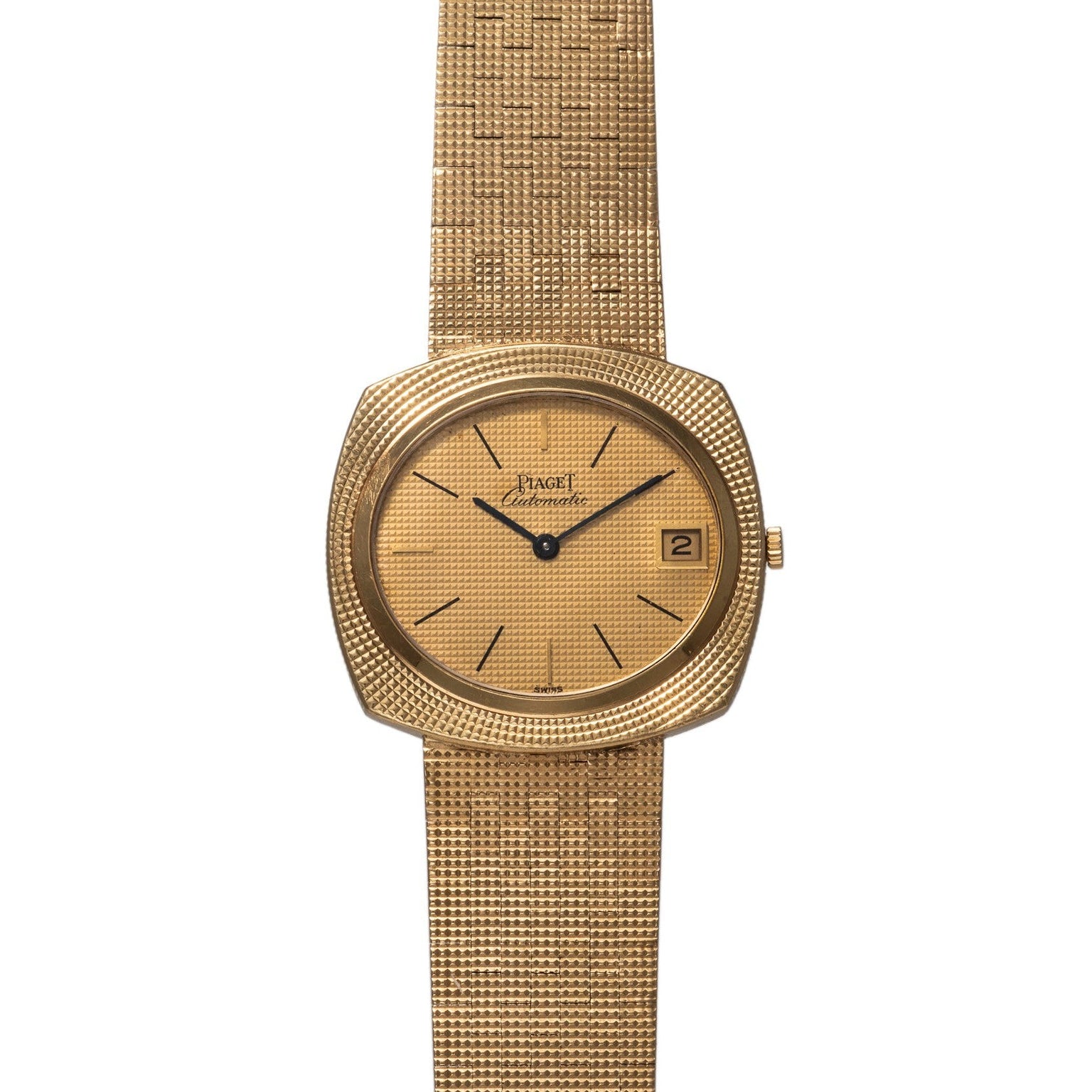 Piaget Yellow Gold Hobnail Dress Watch featuring a textured band, simple black hour markers, and a date window at 3 oclock.