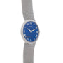 The Piaget Lapis Lazuli Dress Watch features a silver mesh strap, blue face, Roman numerals, and Piaget branding at the center.