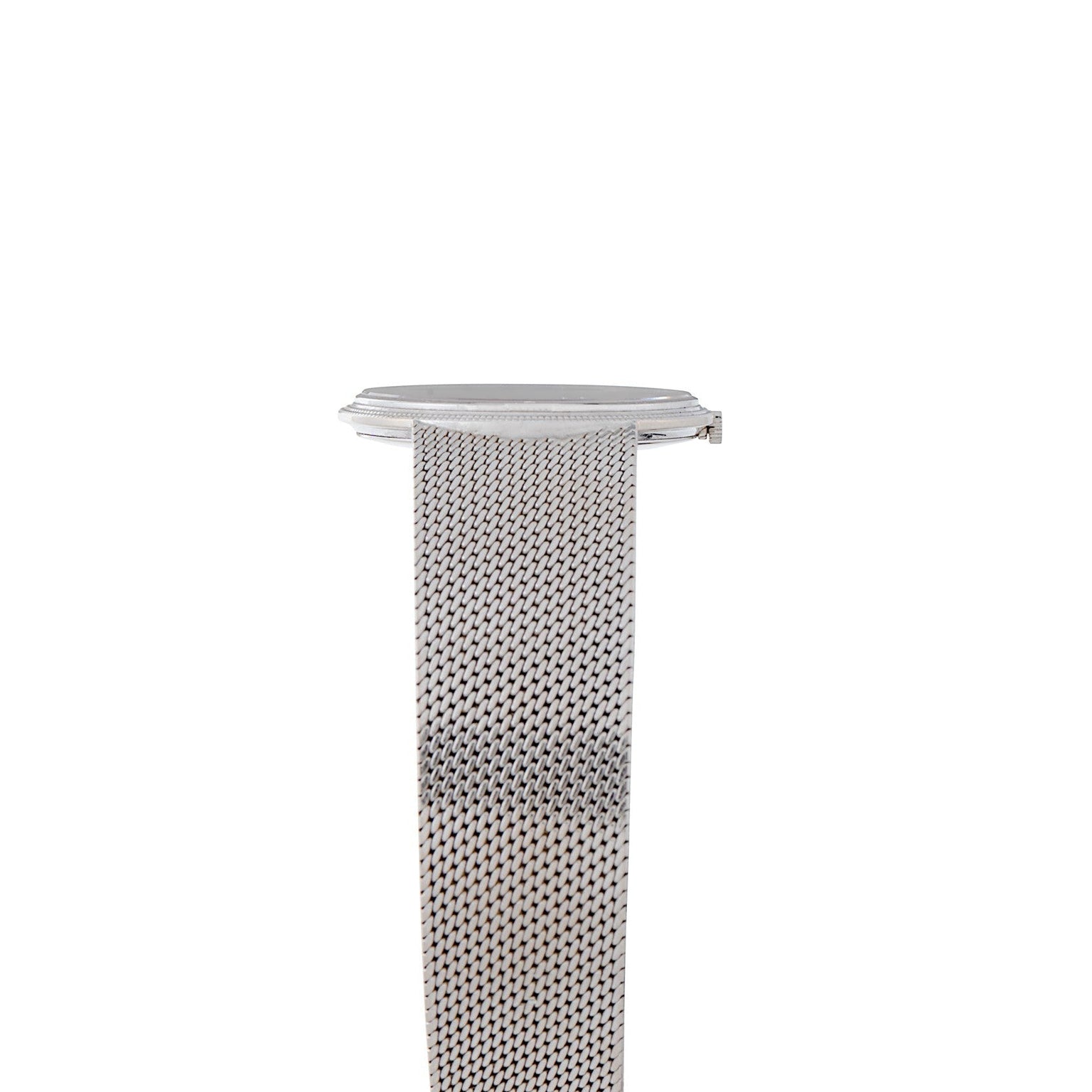 The Piaget Lapis Lazuli Dress Watch features a silver mesh band and a round, minimal face, displayed from the side against a white background.