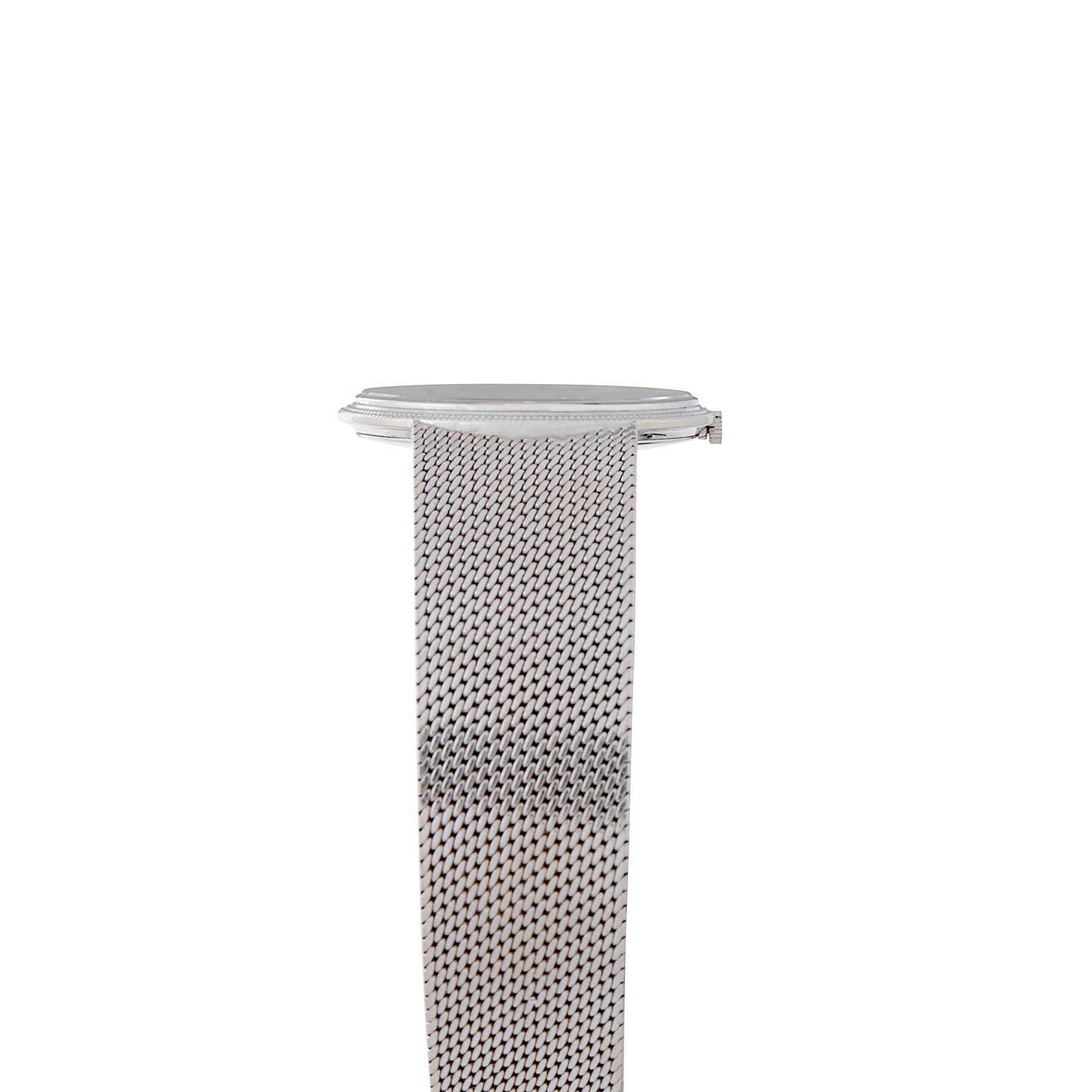 The Piaget Lapis Lazuli Dress Watch features a silver mesh band and a round, minimal face, displayed from the side against a white background.