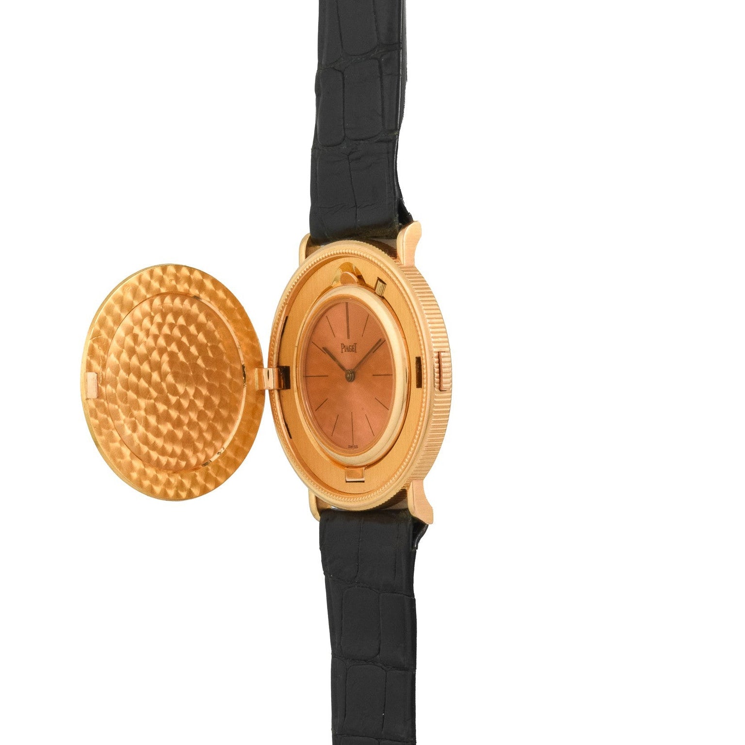 The Piaget 1877 Twenty Dollar Coin Watch features a textured open cover and black leather strap, revealing the elegant watch face.