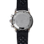 The back of a Breitling Superocean Slow Counting Chronograph with a black Tropic rubber strap.