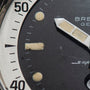 Close-up of the Breitling Superocean Slow Counting Chronograph watch face, displaying the numbers 40 and 50, with white hour and minute hands.