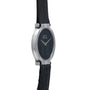 A white gold oval ladies watch by Piaget, featuring a leather strap, silver casing, and a minimalist black dial.