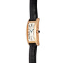 Cartier Tank Americaine gold wristwatch with a rectangular face, Roman numerals, and a black leather strap shown in side view.