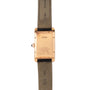 Back view of the Cartier Tank Americaine wristwatch featuring a tan leather strap and visible engravings on the case back.