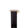 Side view of the Cartier Tank Americaine wristwatch with a black leather strap and gold-tone case against a white background.
