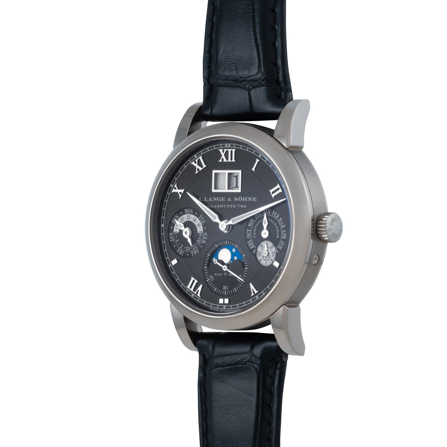 The Langematik Perpetual Calendar by Lange & Sohne is a luxury wristwatch featuring a black leather strap, moon phase dial, and Roman numerals on a dark face.