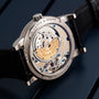 A close-up of the Langematik Perpetual Calendar by Lange & Sohne reveals the intricate mechanical components on its detailed caseback.