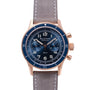 The Blancpain Air Command Flyback Chronograph features a blue dial with chronograph subdials, a rose gold case, and a grey leather strap for a luxurious look.