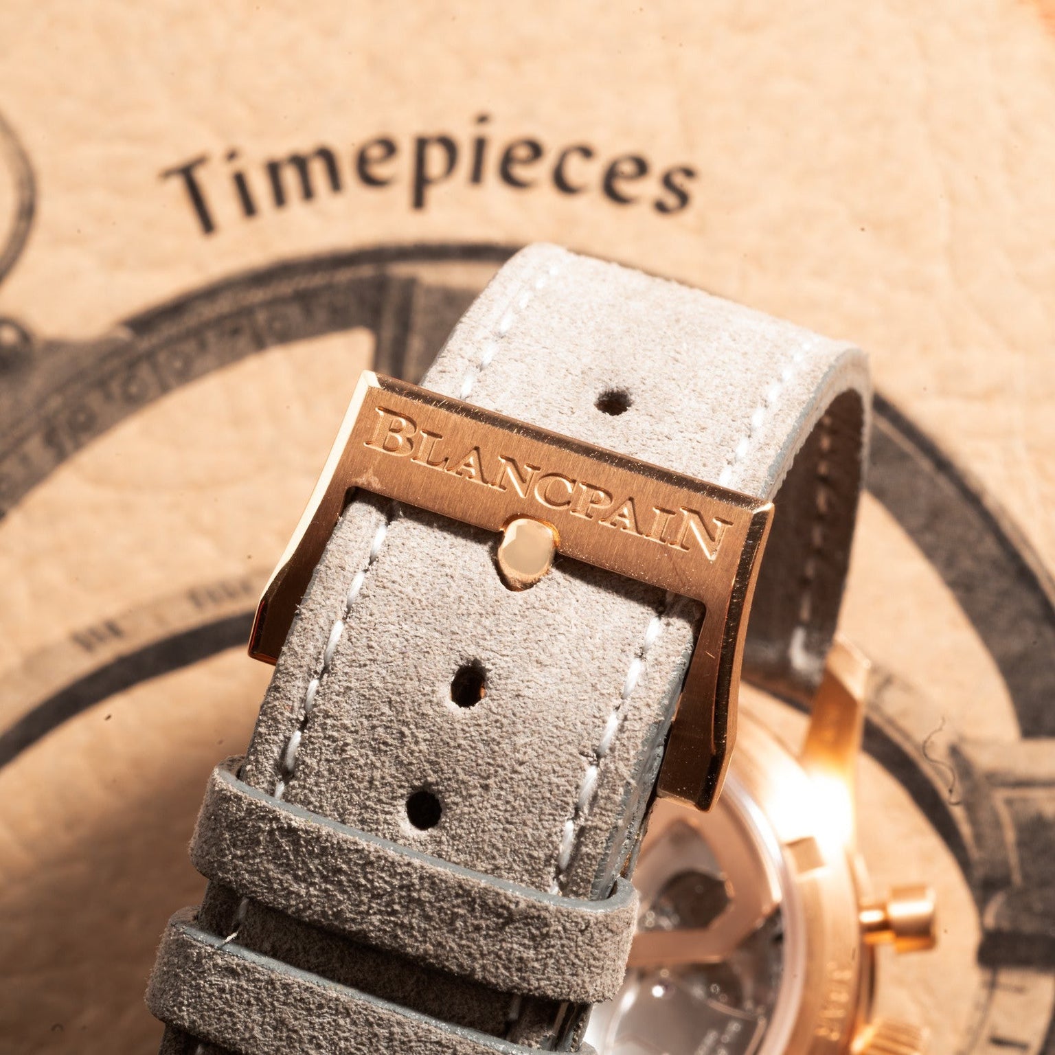 Close-up of a Blancpain Air Command Flyback Chronograph watch strap buckle with Timepieces in the background.