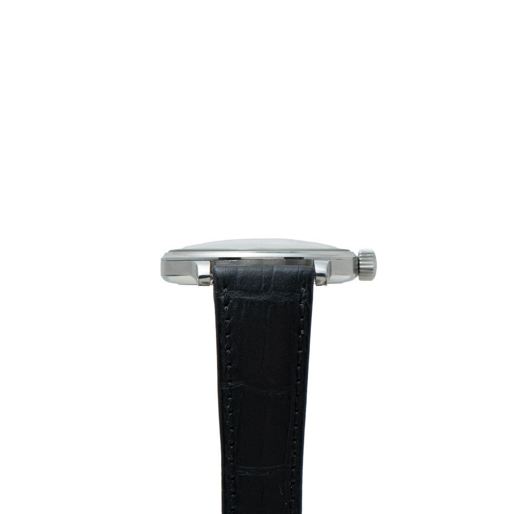 Side view of the IWC Schaffhausen Portugieser wristwatch featuring a black leather strap and silver case against a white background.