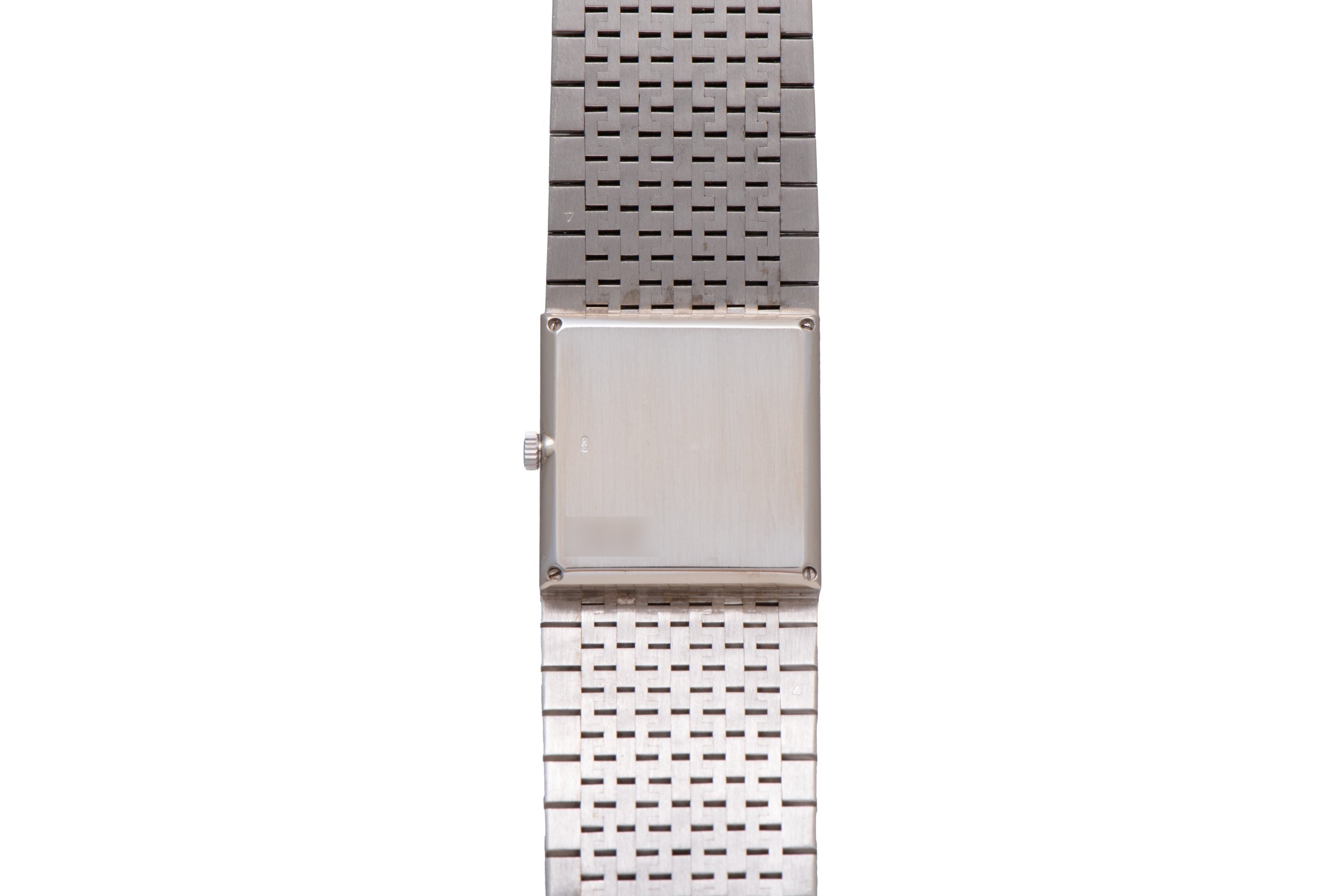 The Piaget White Gold Malachite Dress Watch features a square blank face and a linked band, showcased against a white background.