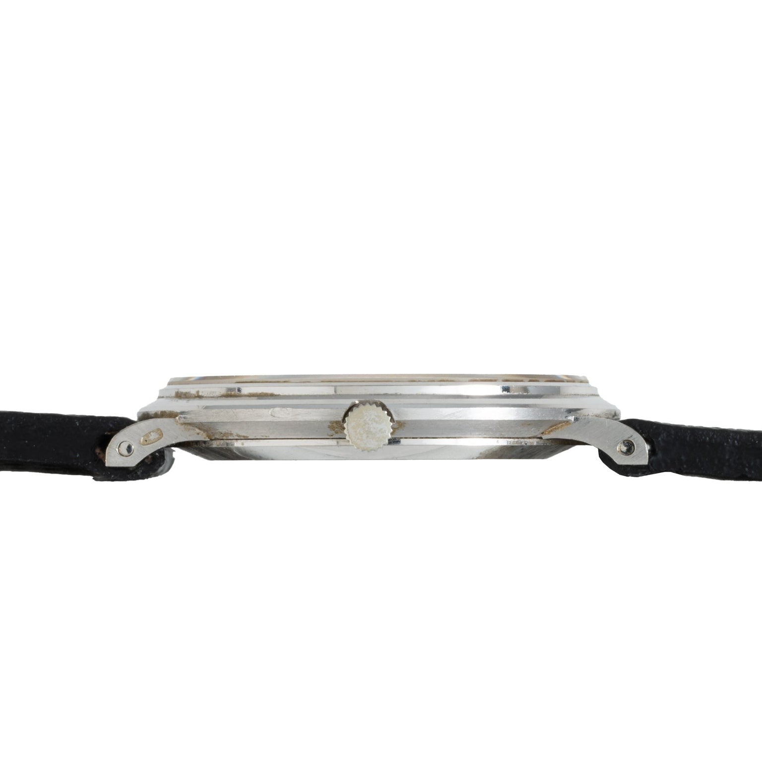 Side view of the Piaget Ladies Lapis Lazuli Dress Watch, featuring a slim profile, silver case, black strap, and visible watch crown.