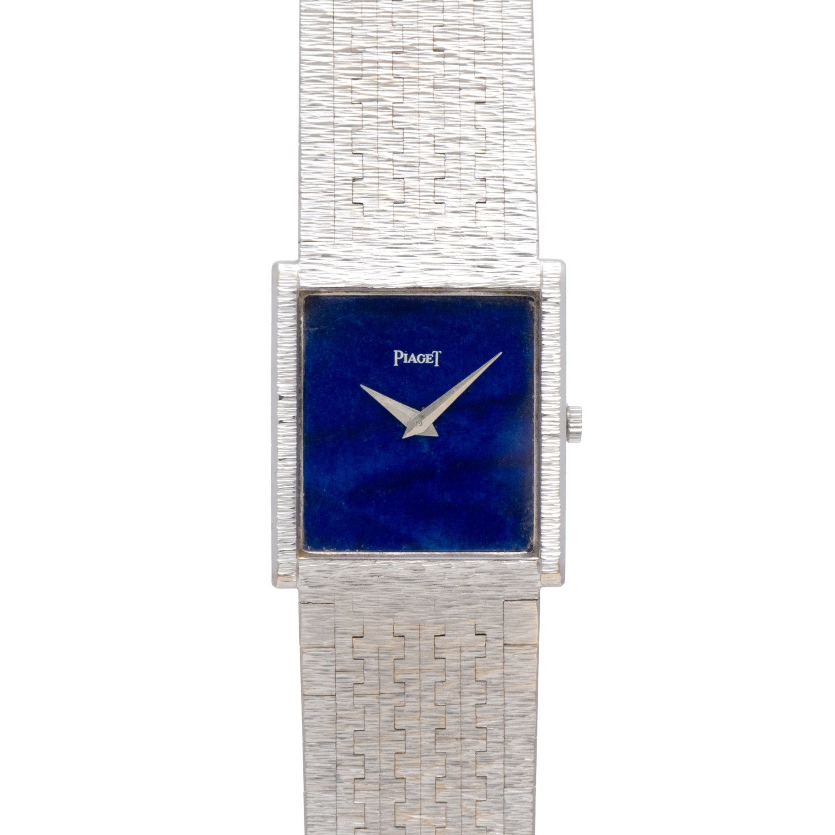 A Piaget White Gold Lapis Lazuli Dress Watch with a square blue face and textured metal band is displayed on a white background.