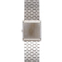 A White Gold Lapis Lazuli Dress Watch by Piaget, featuring a square face and metal link bracelet, is shown from the back.