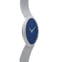 The Cartier White Gold Lapis watch features a blue face without numbers and a silver mesh band, displayed from a side angle.