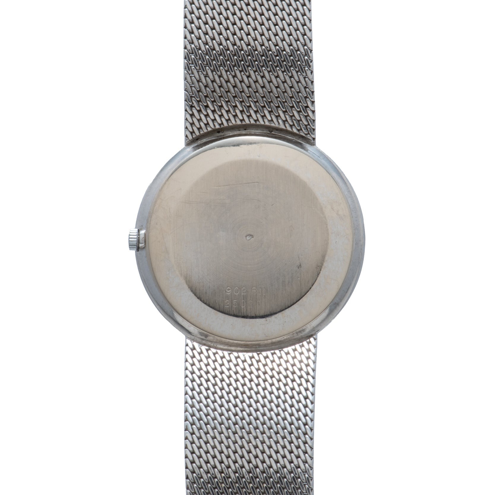 The Cartier White Gold Lapis watch is shown from the back, featuring a mesh band and a plain, round case.