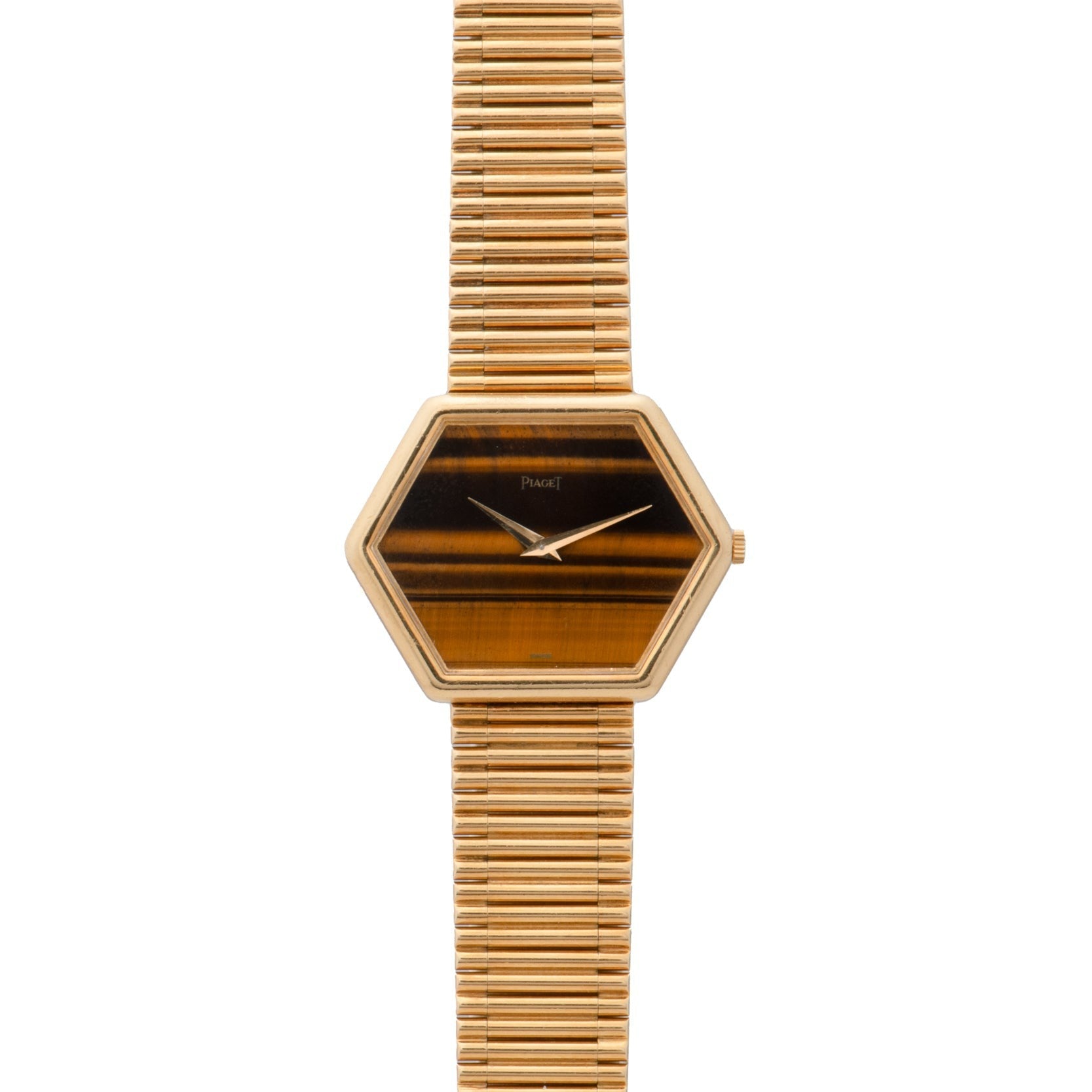 The Piaget Hexagonal Tigers Eye features a gold case, a striped brown face, and a matching gold link bracelet.
