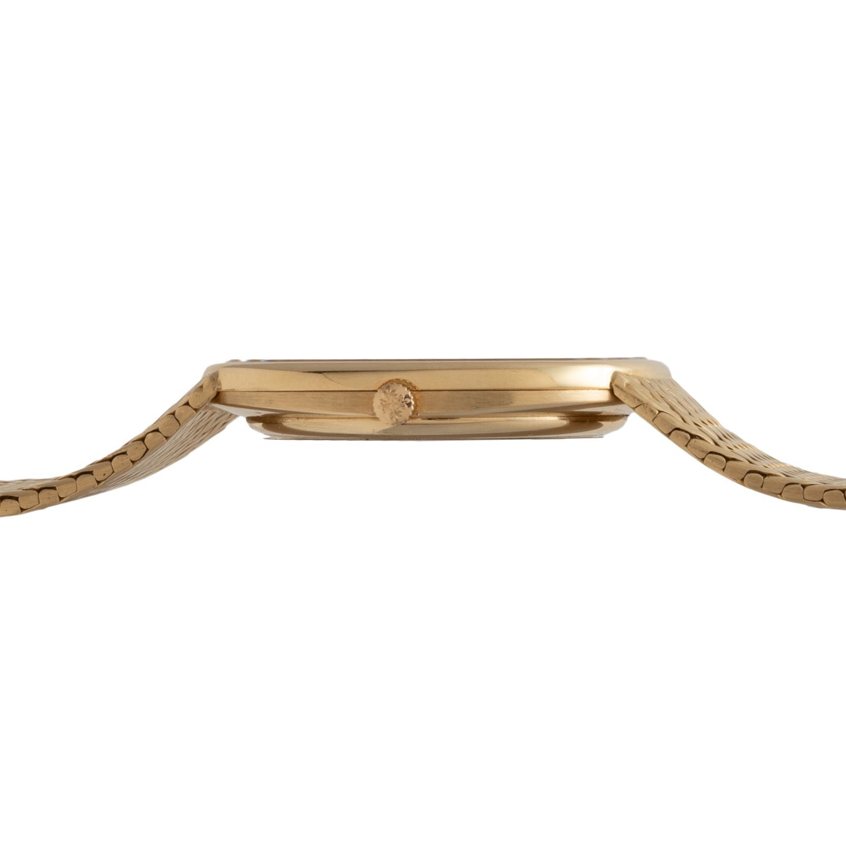 Side view of the Patek Philippe Ellipse Jumbo gold watch, featuring a thin case and textured metal band, shown on a white background.