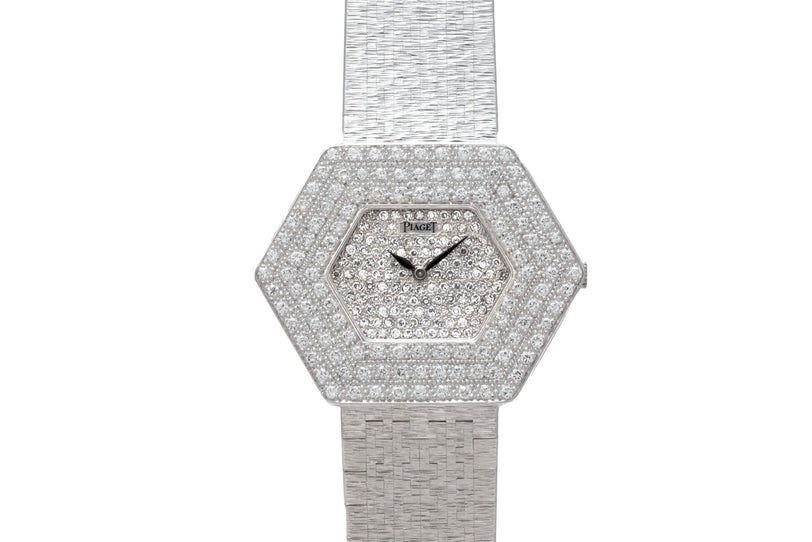 The Piaget Hexagonal Diamond Dress Watch features a diamond-encrusted face and a textured silver band.