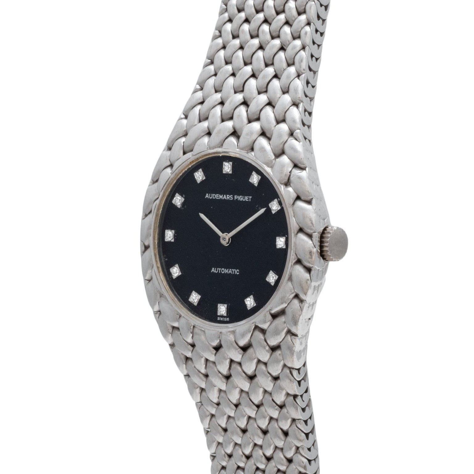 The Audemars Piguet Cobra is a silver wristwatch with a black face, diamond hour markers, and a textured metal band.