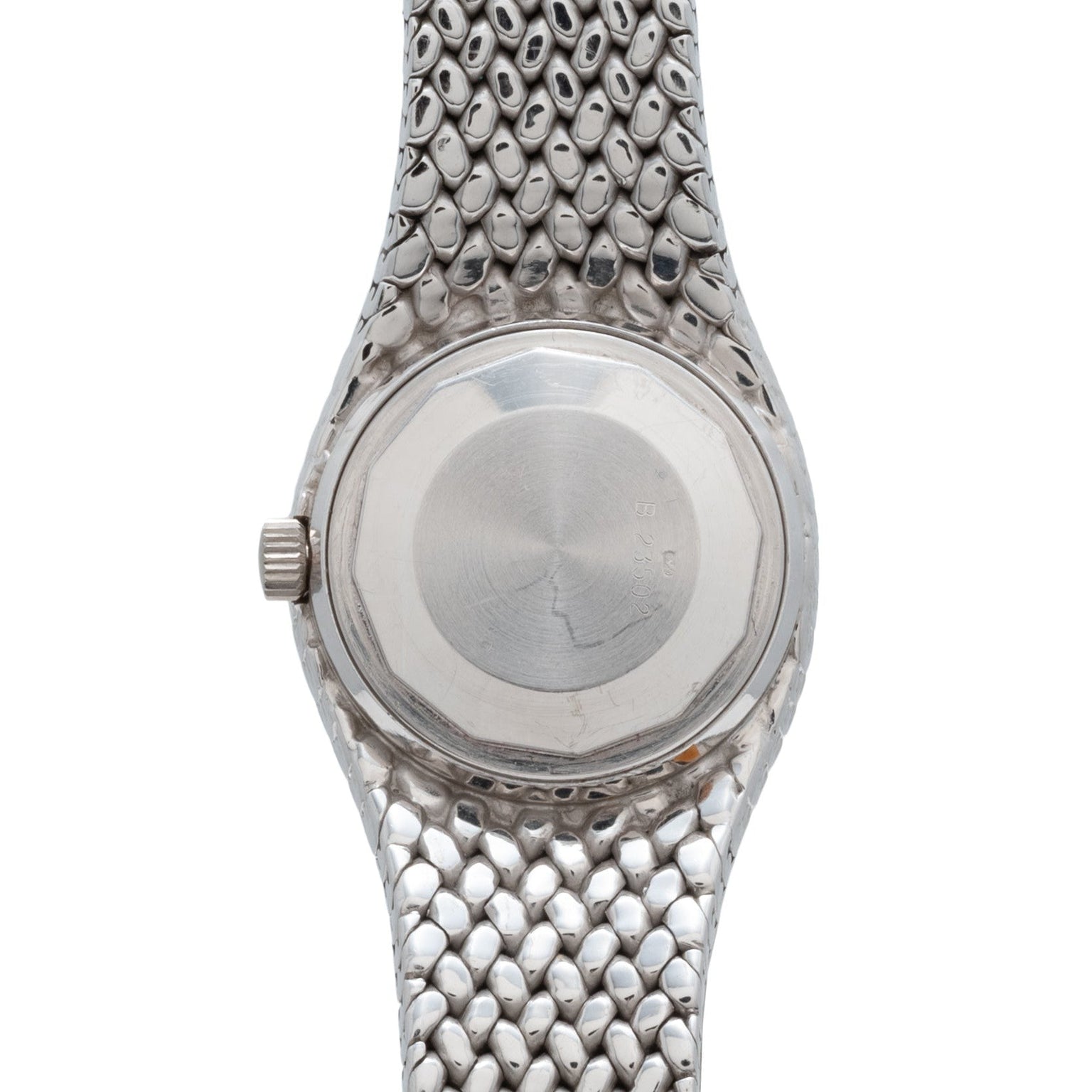 The back of an Audemars Piguet Cobra wristwatch features a round case and a silver, scale-textured metal band.