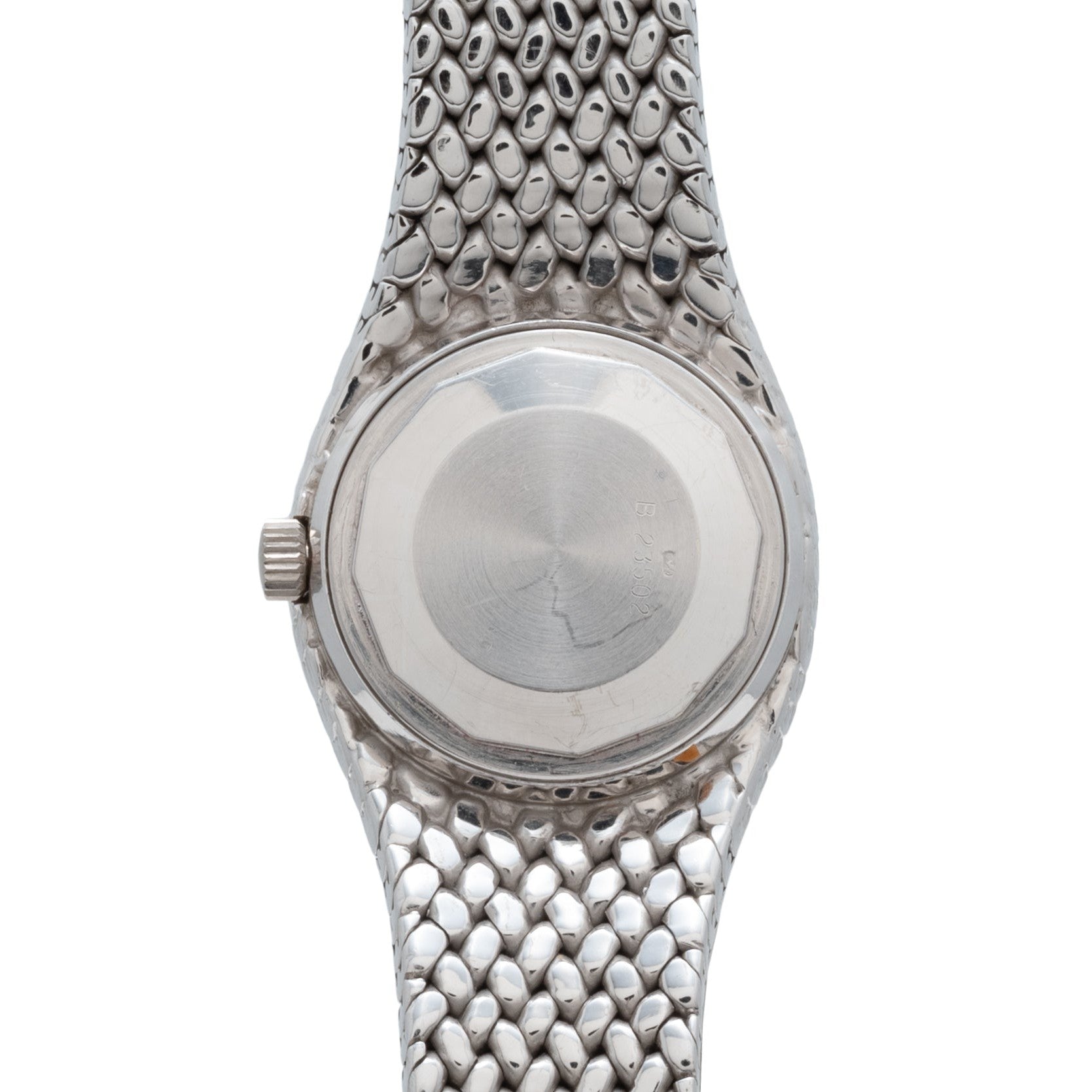 The back of an Audemars Piguet Cobra wristwatch features a round case and a silver, scale-textured metal band.