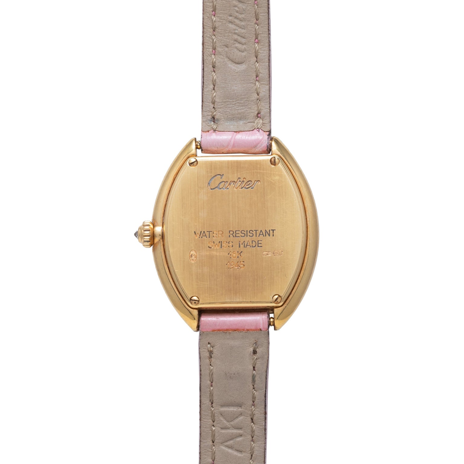 Back view of a Cartier Tortue gold wristwatch featuring a tan leather strap and engraved case markings.
