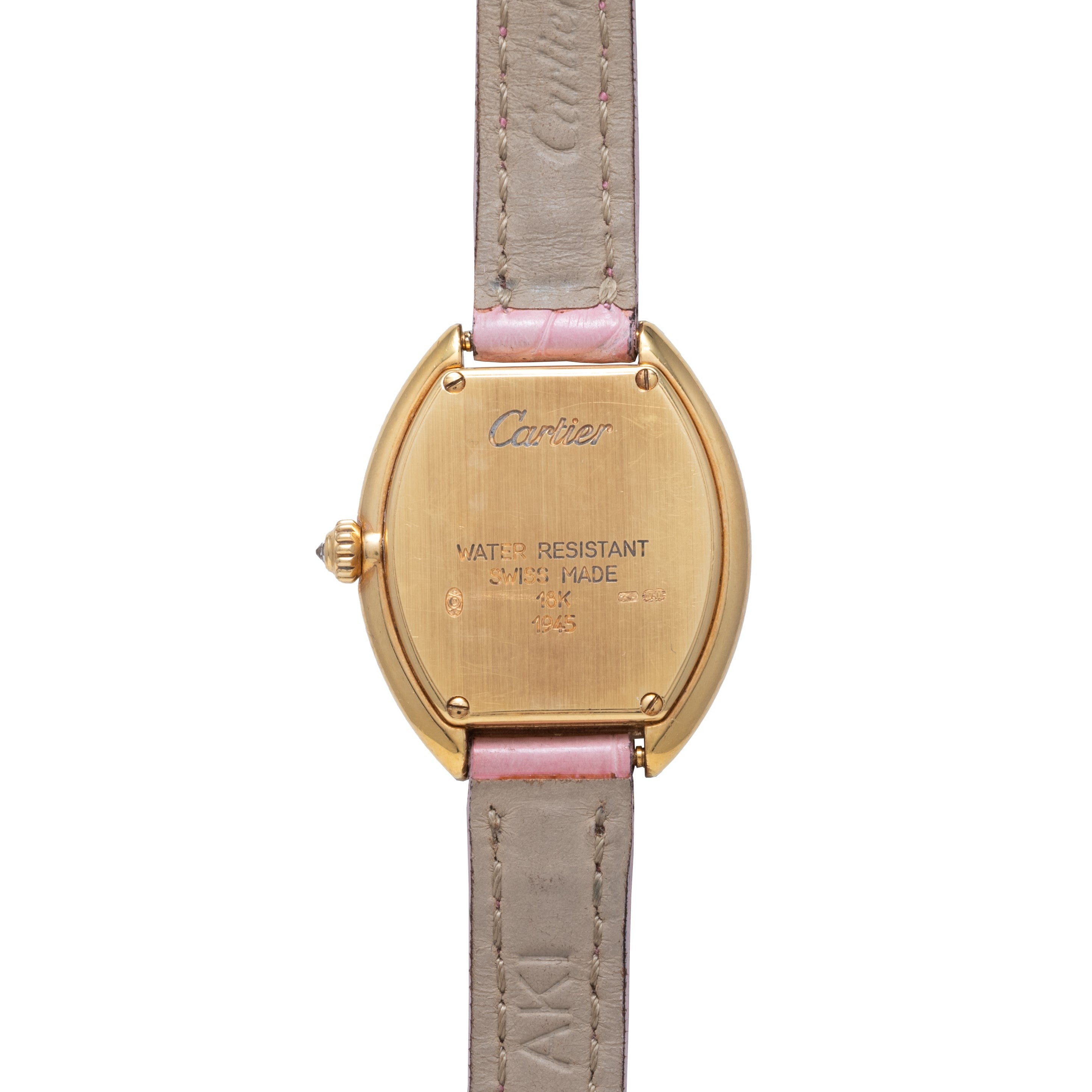 Back view of a Cartier Tortue gold wristwatch featuring a tan leather strap and engraved case markings.