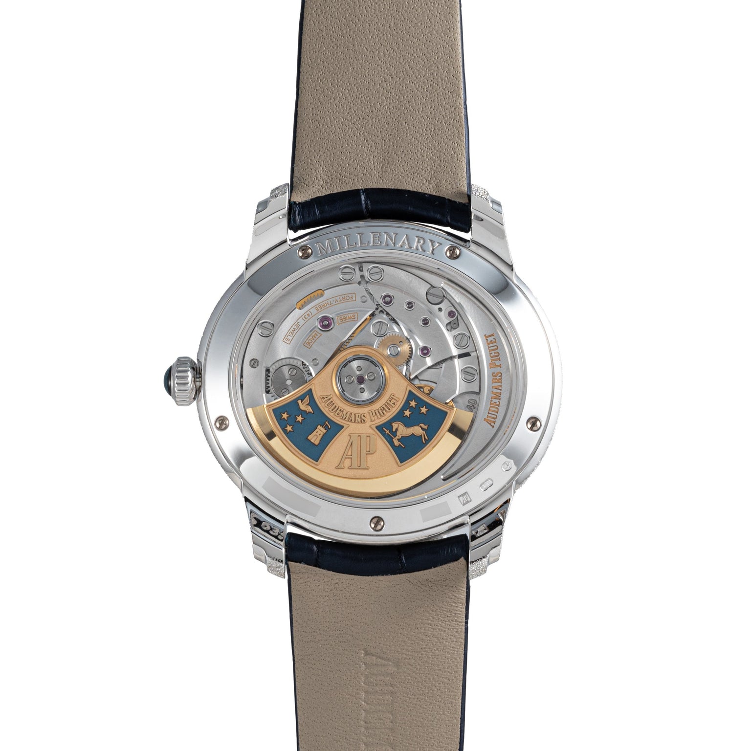 Back view of the Audemars Piguet Millenary Philosophique luxury watch, showcasing its intricate inner mechanics and gold rotor, paired with a leather strap.