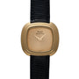 The Piaget Emperador Mini Warhol is a gold quartz watch featuring a square face, black leather strap, and a minimalistic design.