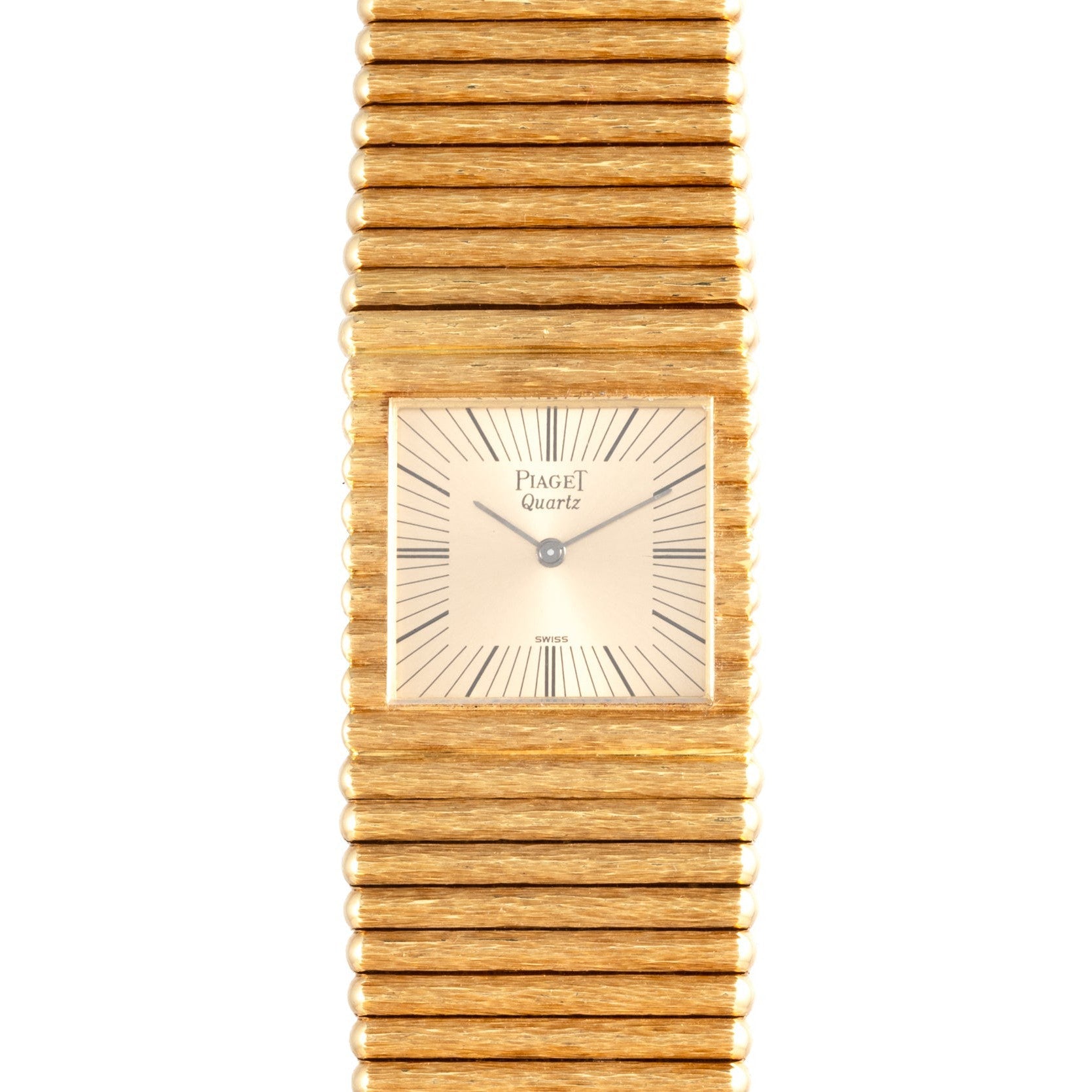 A Piaget Emperador gold quartz wristwatch featuring a square face and a horizontally ridged bracelet.
