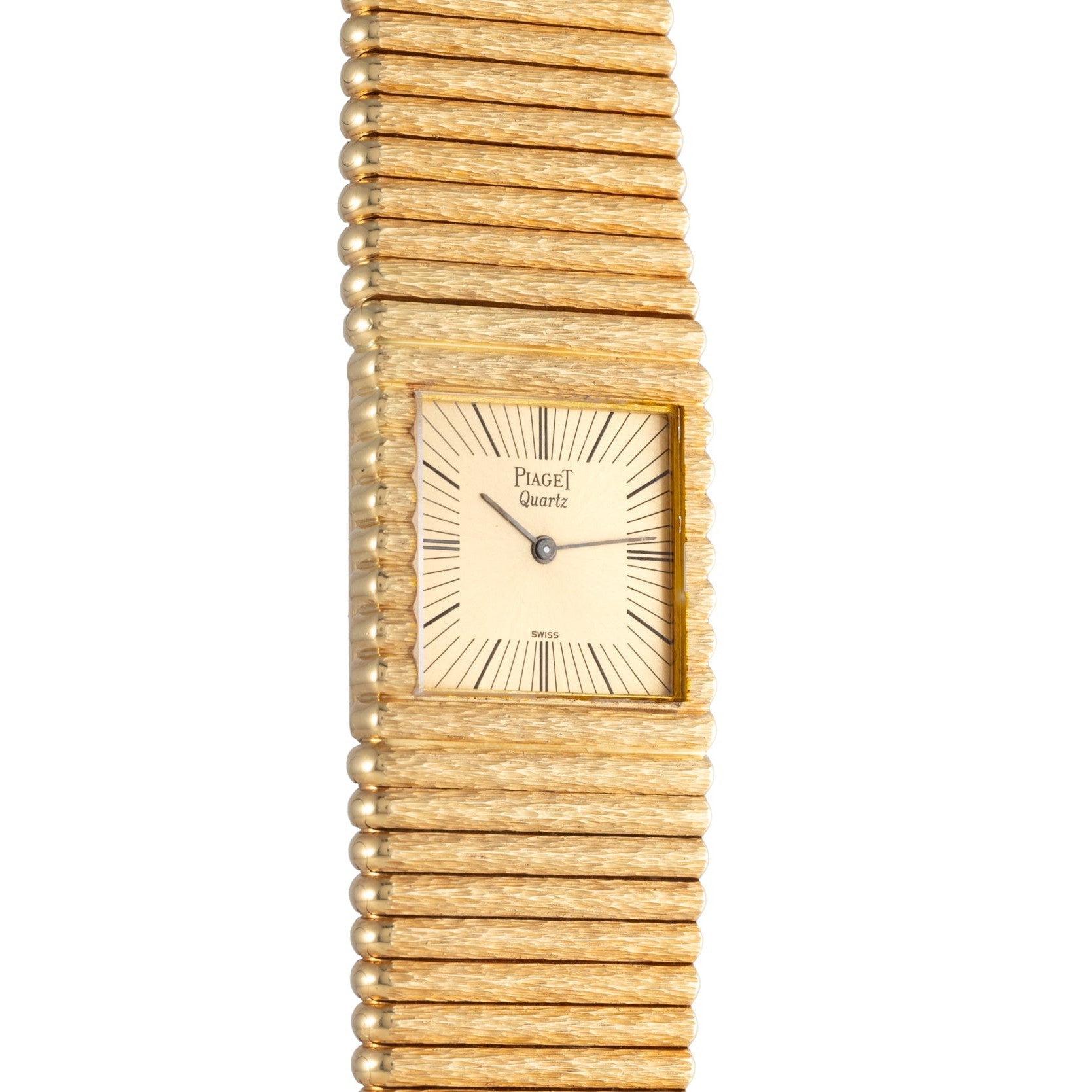 Piaget Emperador gold quartz wristwatch featuring a square face and textured gold bracelet, displaying the time 9:06.