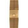The Piaget Emperador gold watch has a blank square face and a ridged metal band, shown from above.