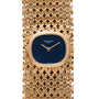 Patek Philippe Ellipse Ladies Woven Cuff watch in gold, featuring a blue face and intricate bracelet design, set to 10:11.