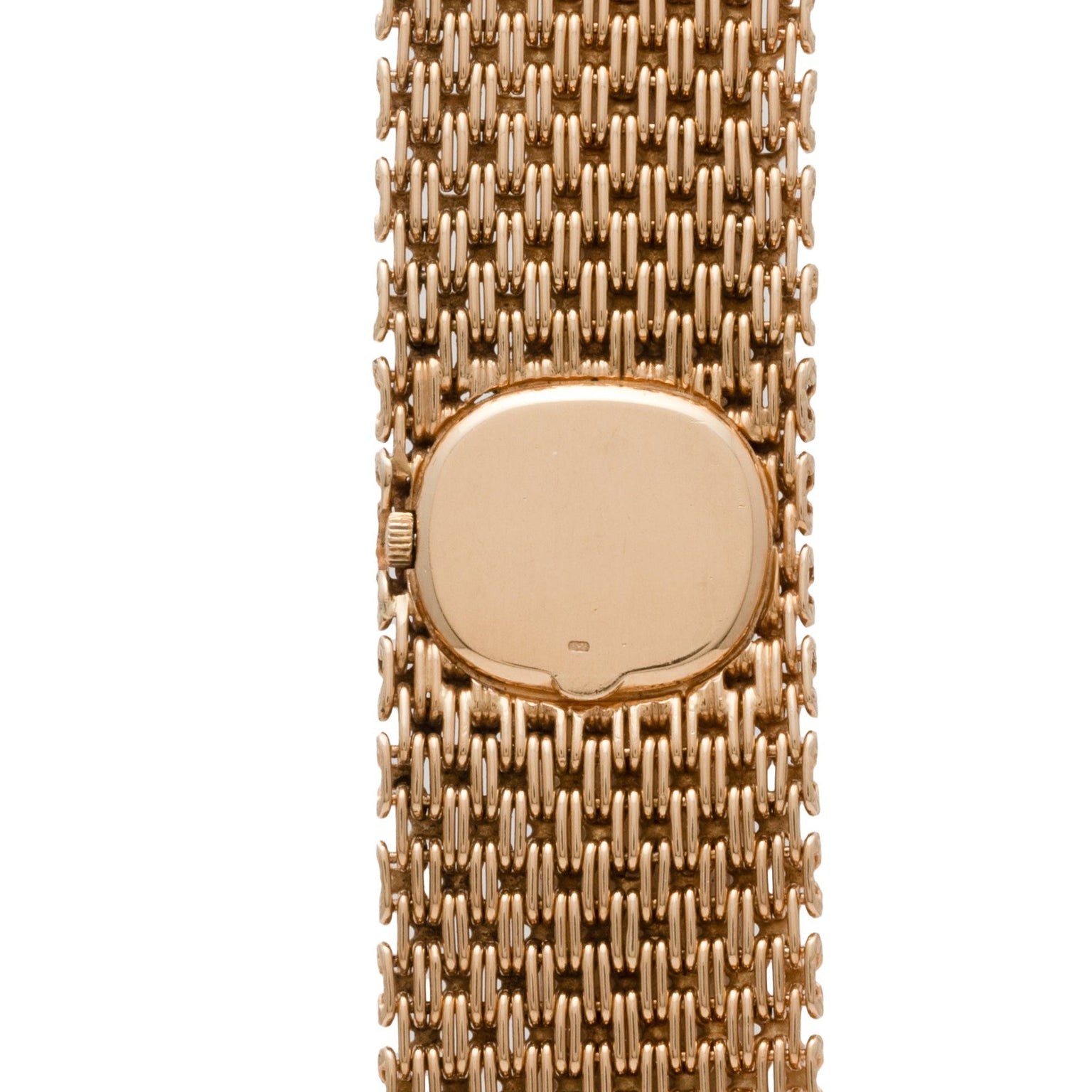 Close-up of the Patek Philippe Ellipse Ladies Woven Cuff, a gold watch with a mesh band and an oval, minimalist face free of hands or markers.