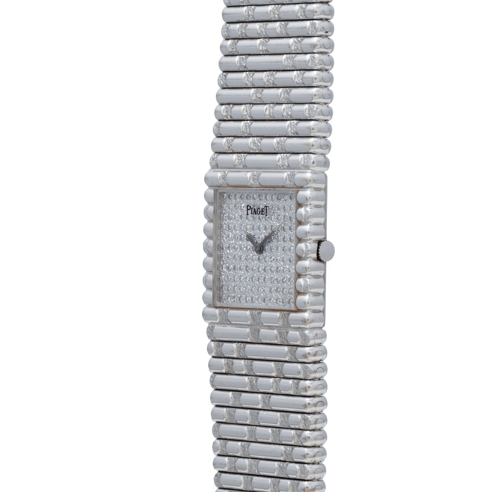 The Piaget Emperador Diamond is a luxury silver wristwatch featuring a rectangular face and a textured metal band.