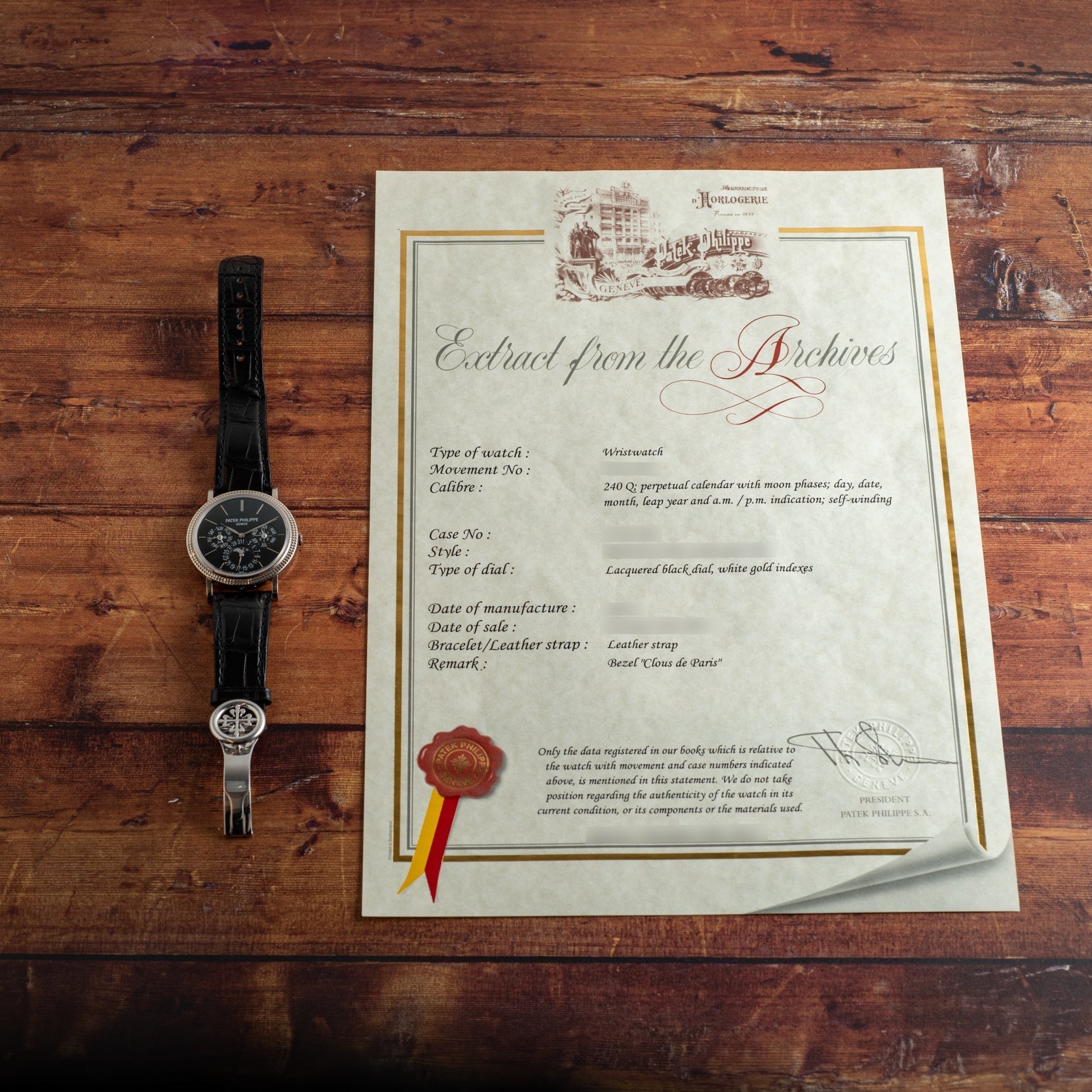 A Patek Philippe Perpetual Calendar Moonphase with a black leather strap rests beside a certificate titled Extract from the Archives.