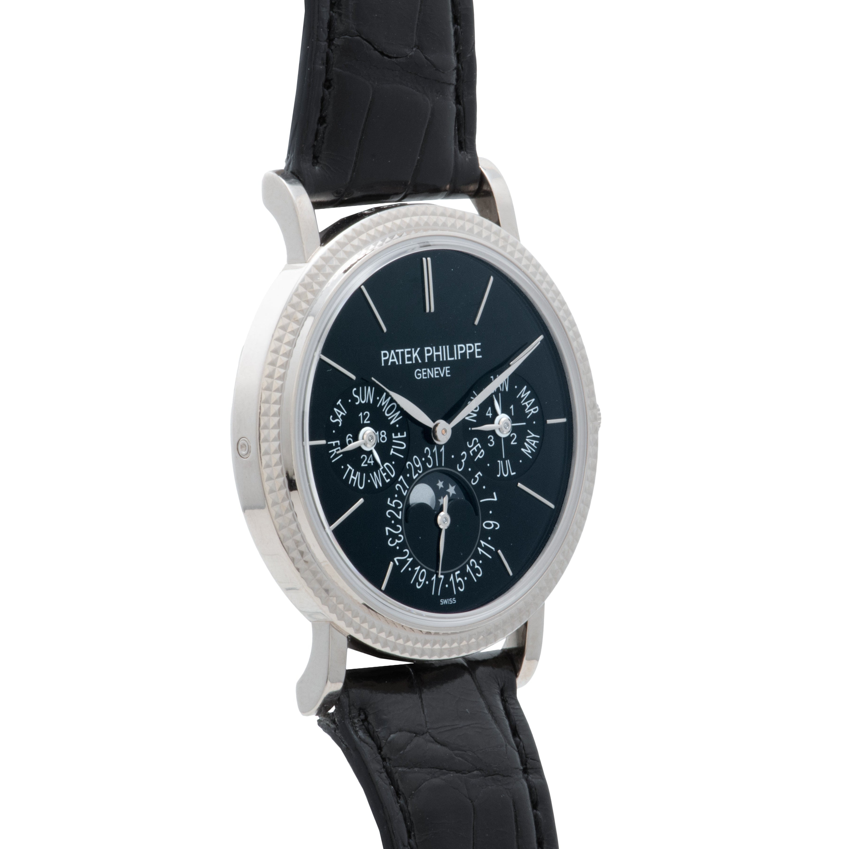 A Patek Philippe Perpetual Calendar Moonphase wristwatch in black with a silver case and multiple dials.