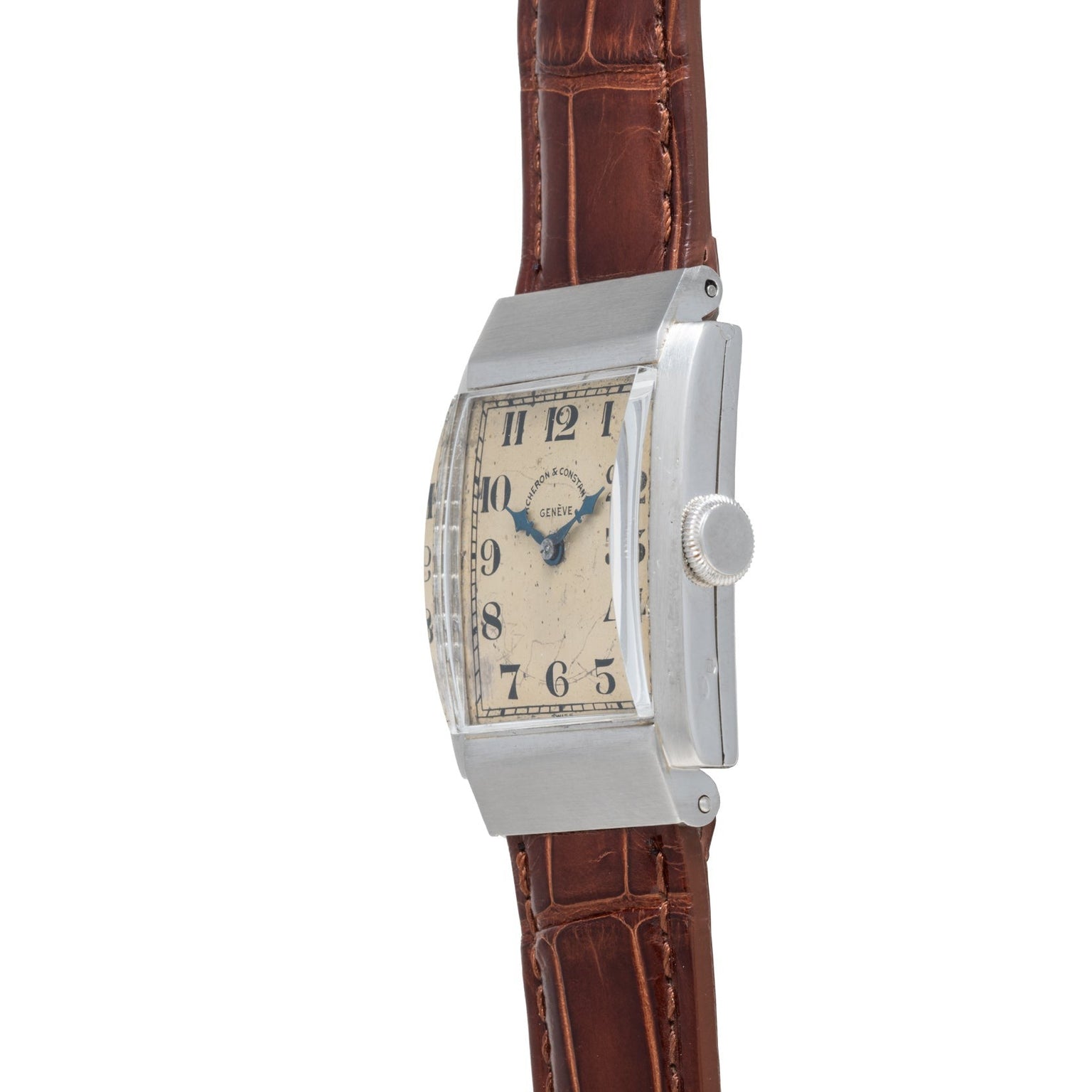 The Vacheron Constantin Rectangular Steel Dress Watch features a silver case and brown leather strap, displayed from the side.