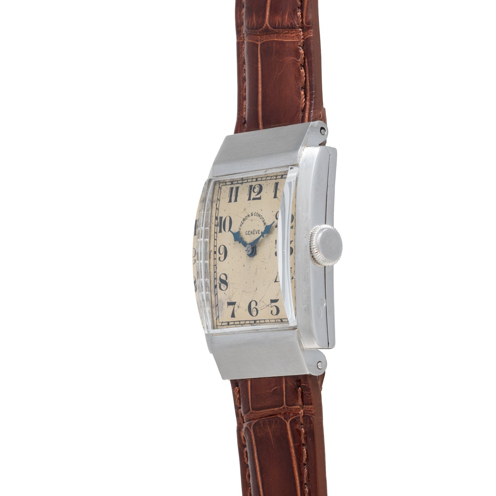 The Vacheron Constantin Rectangular Steel Dress Watch features a silver case and brown leather strap, displayed from the side.