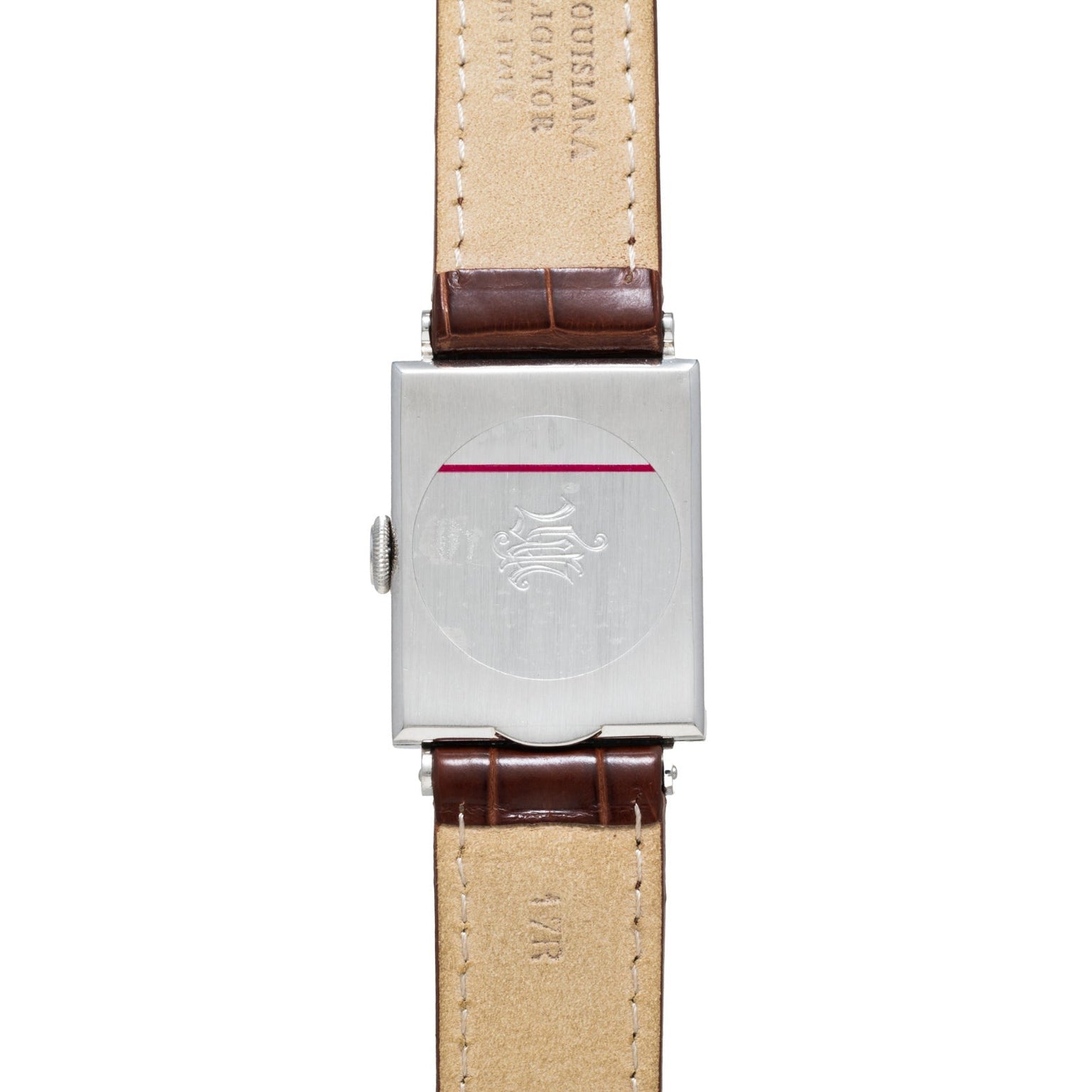 The back view of the Vacheron Constantin Rectangular Steel Dress Watch displays its engraved logo and features a brown leather strap.
