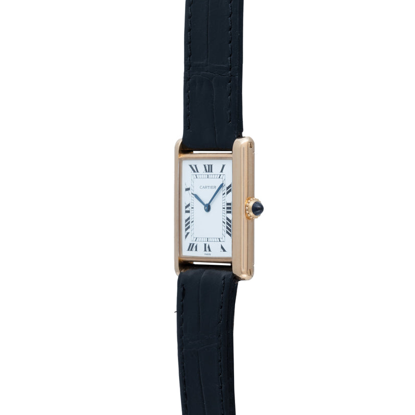 The Cartier Tank Louis is a gold rectangular wristwatch featuring a black leather strap and Roman numerals on its white dial.