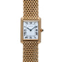 The Cartier Tank Louis wristwatch features a gold case, white square dial with Roman numerals, and a gold mesh bracelet.