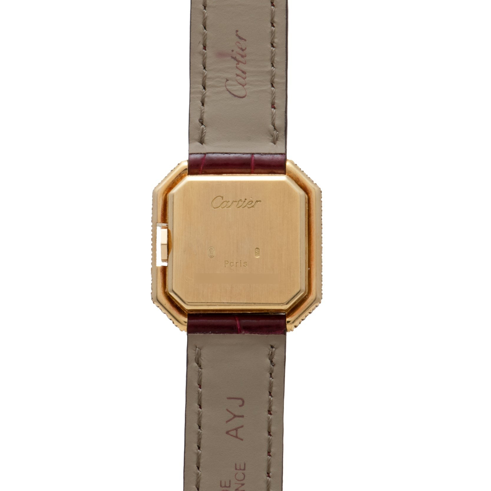 Back of a square gold Cartier Ceinture Diamond watch with brown leather strap and engraved Cartier branding.