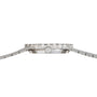 Side view of the Piaget Opal White Gold Dress Watch, featuring a slim profile, silver metal band, and ridged bezel.