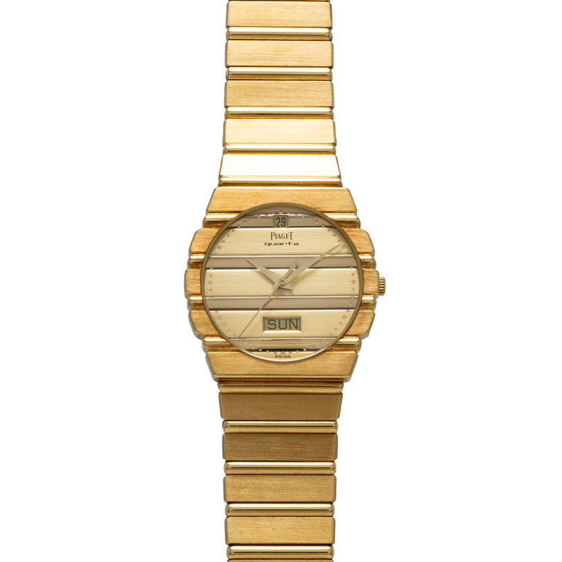 Piaget Polo Calendar gold wristwatch featuring a matching gold band, day and date display, and horizontal lines on the dial.