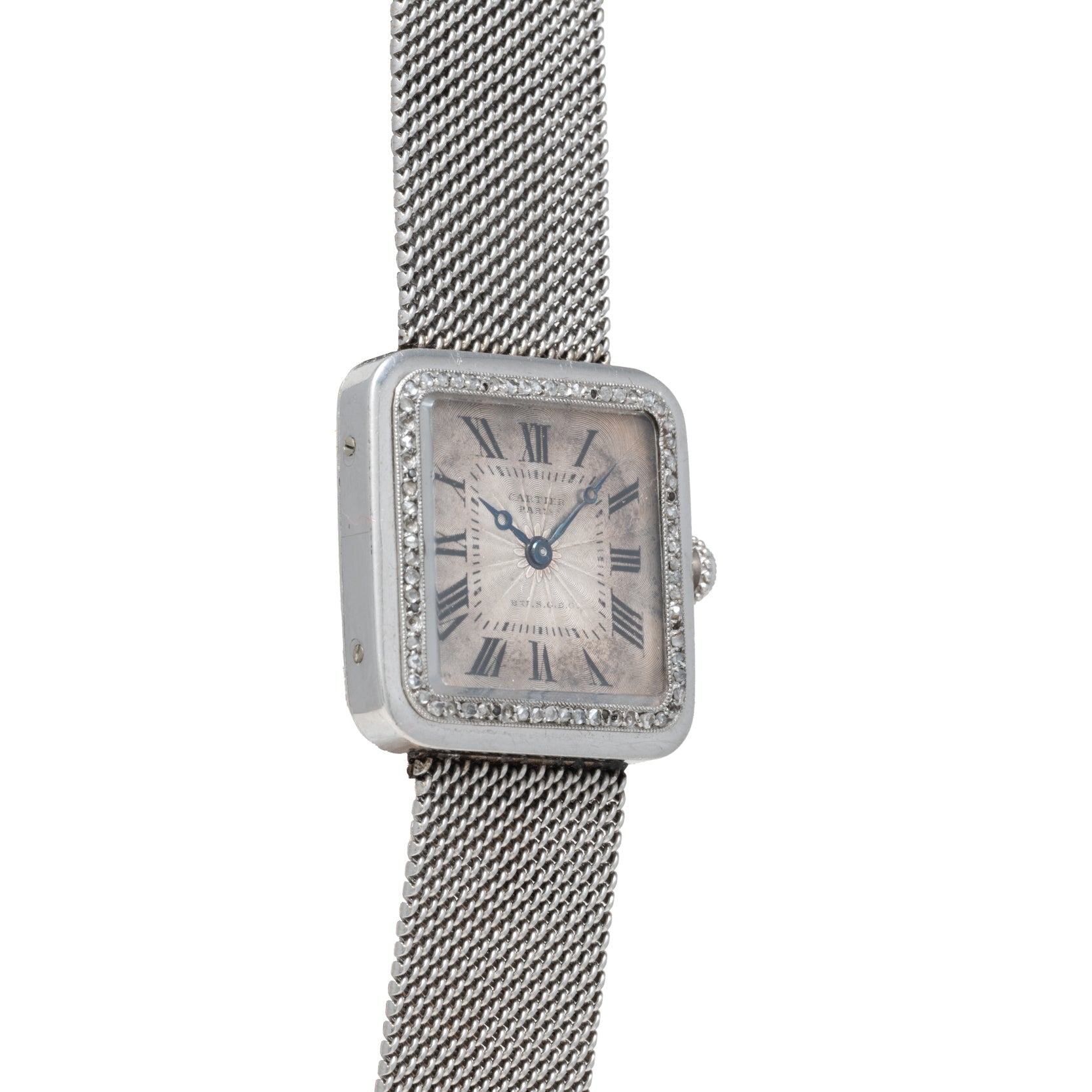 The Cartier Santos Platinum is a square-faced platinum wristwatch with a mesh band, Roman numerals, and a diamond-set bezel.