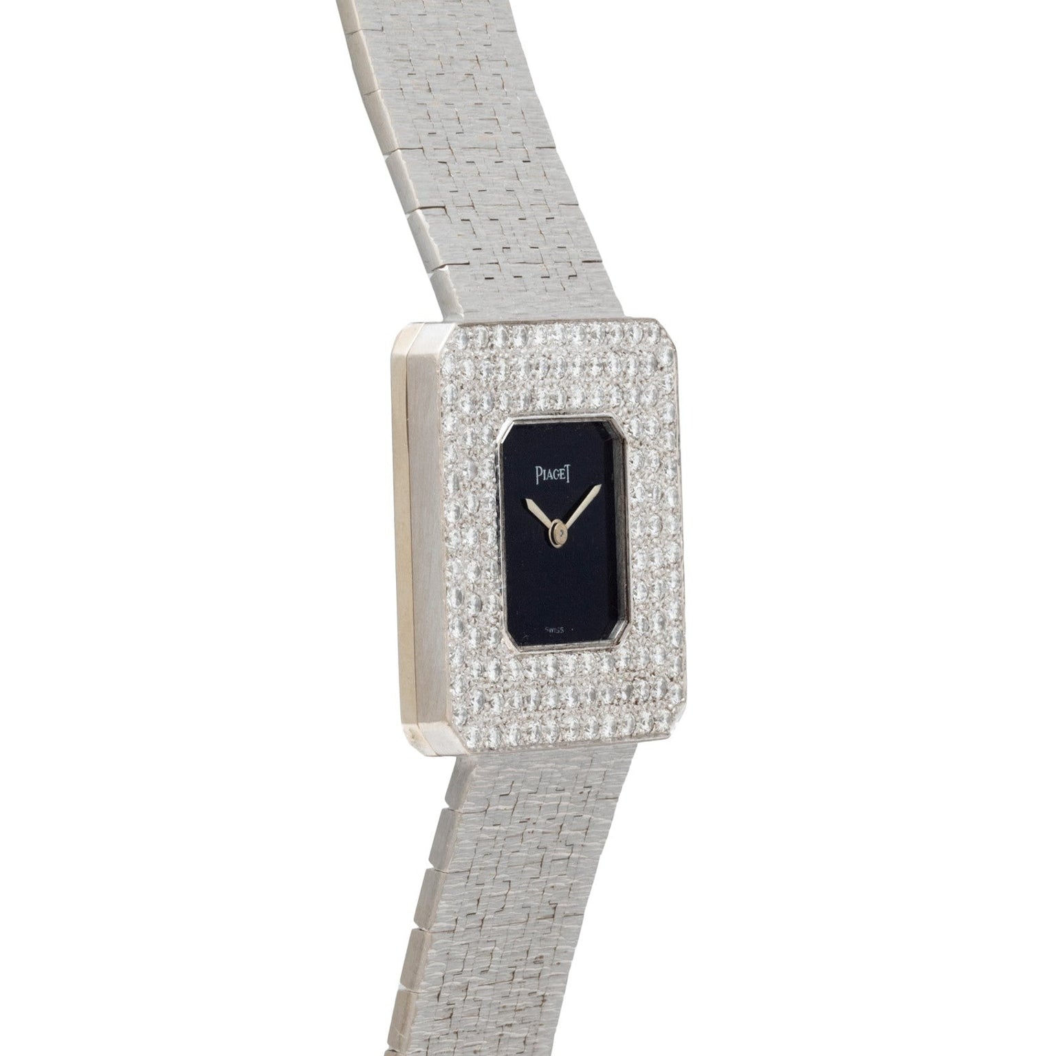 The Piaget Onyx Diamond Dress Watch features a square silver case, black dial, diamond-encrusted bezel, and a textured silver band.